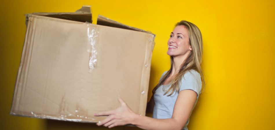 women moving box